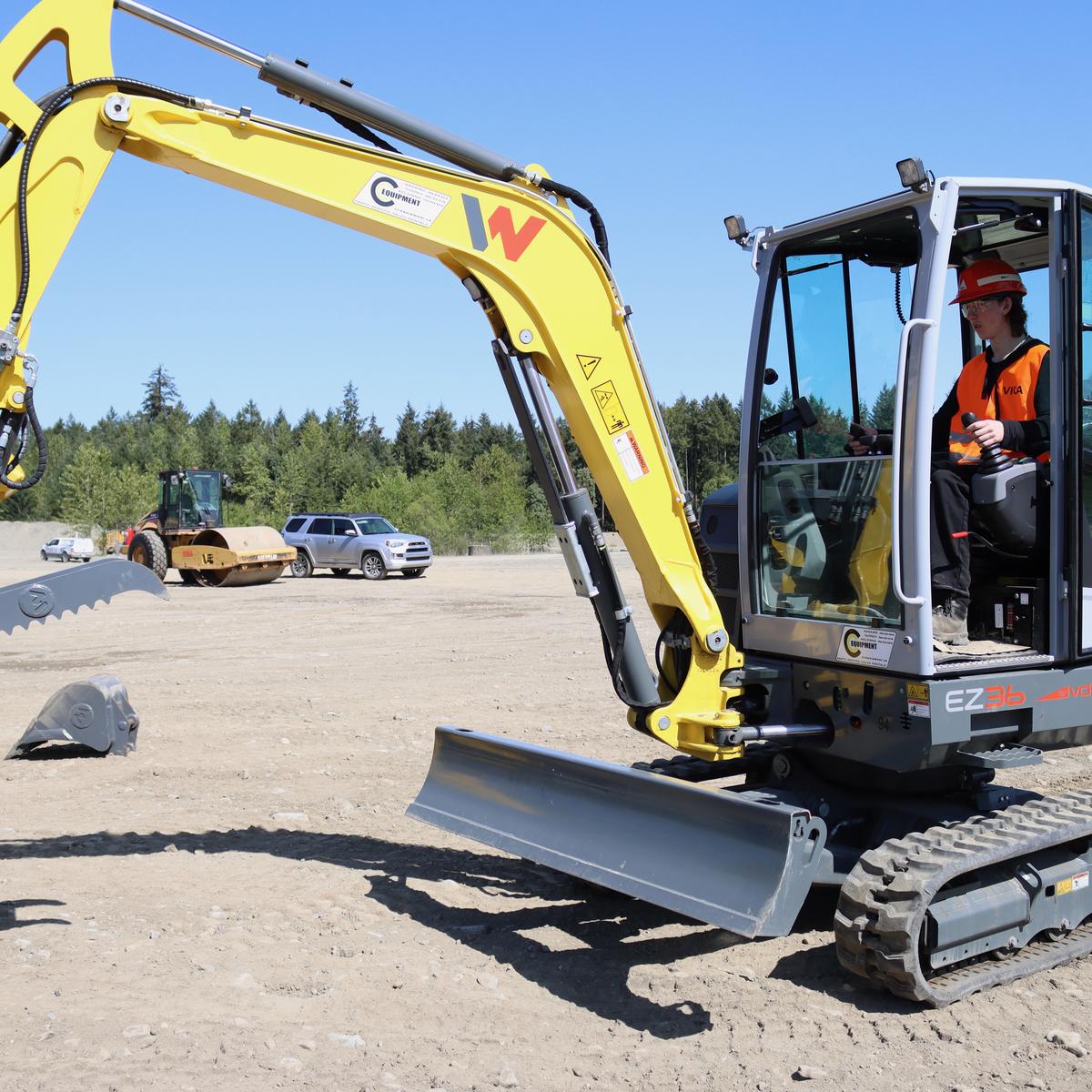 a person operates an excavator