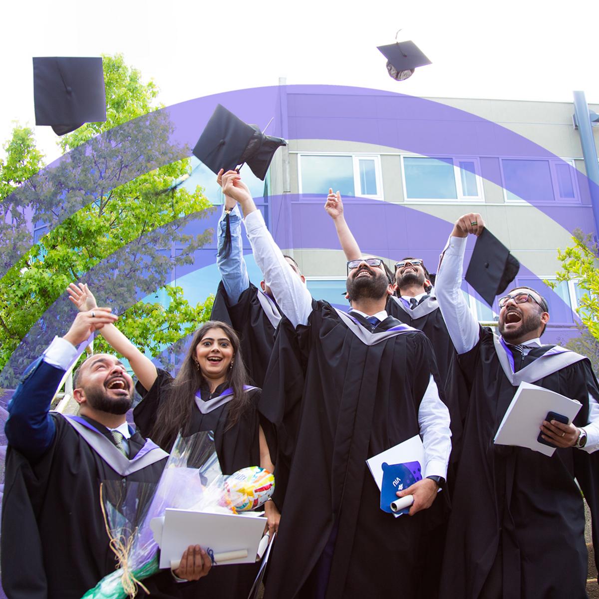 Grads throw their caps in the air