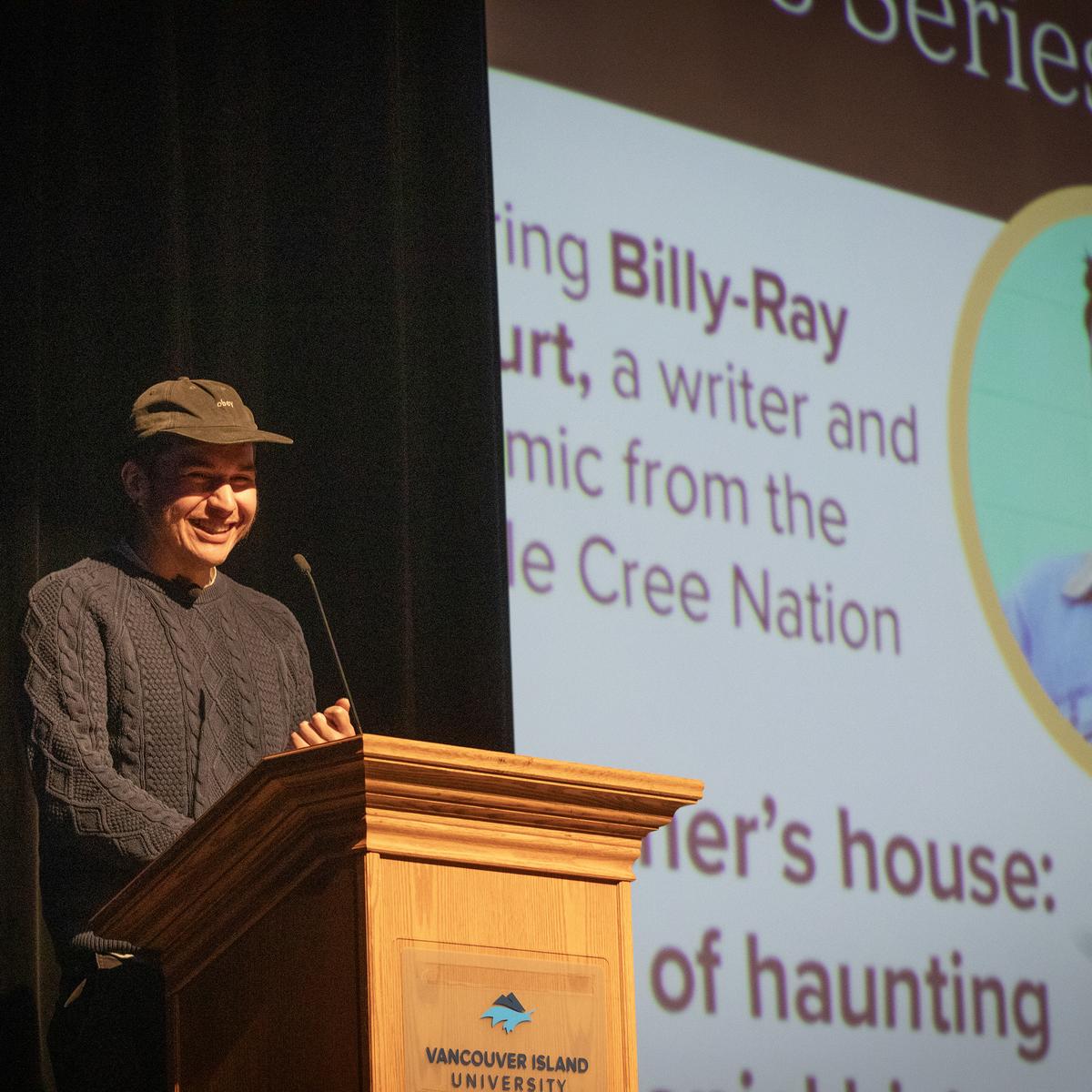 Billy-Ray Belcourt speaks at the VIU podium