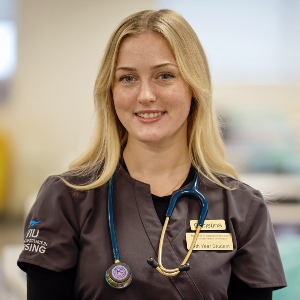 Christina smiling at the camera while wearing a VIU Nursing shirt.