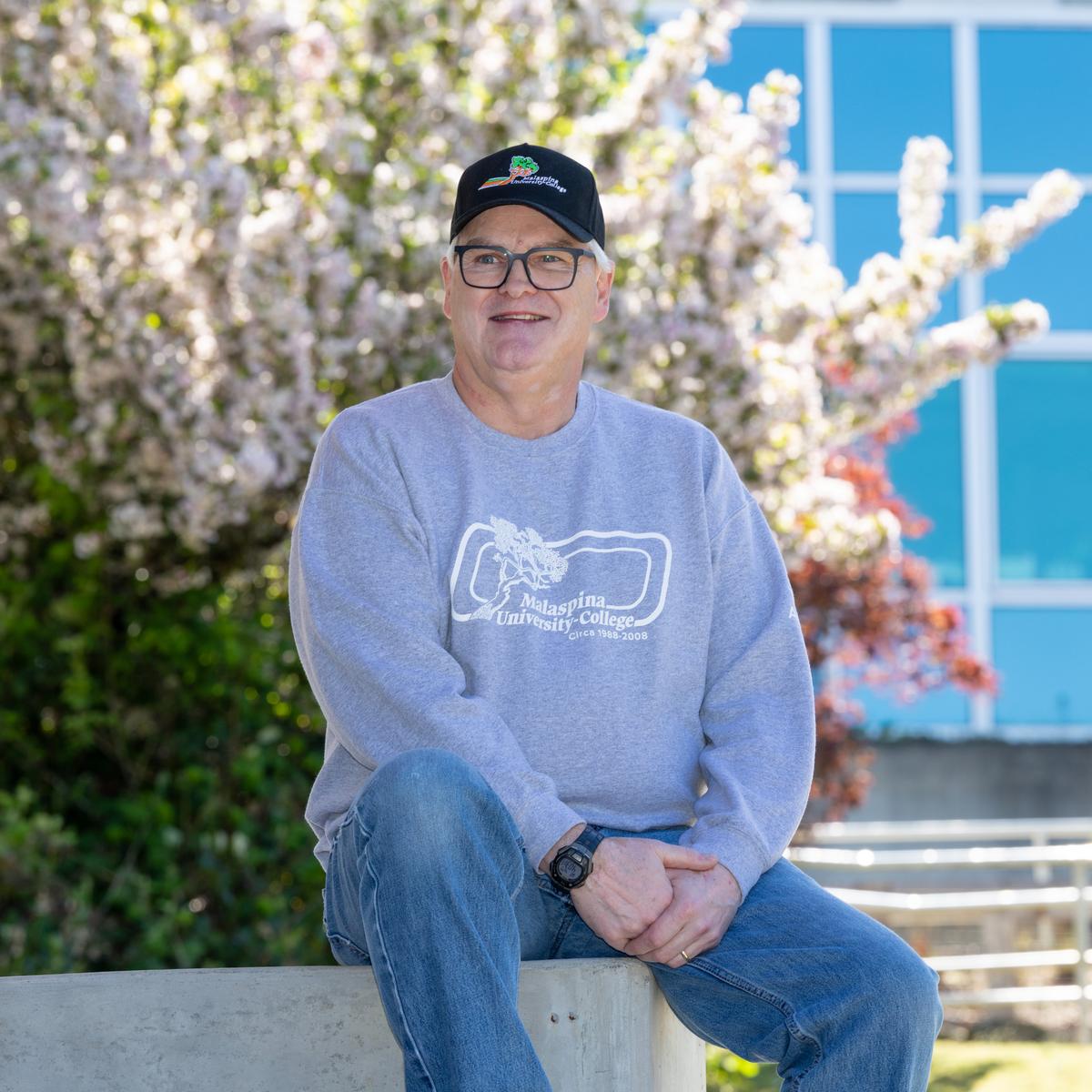 David Butler sitting outside on a sunny day.