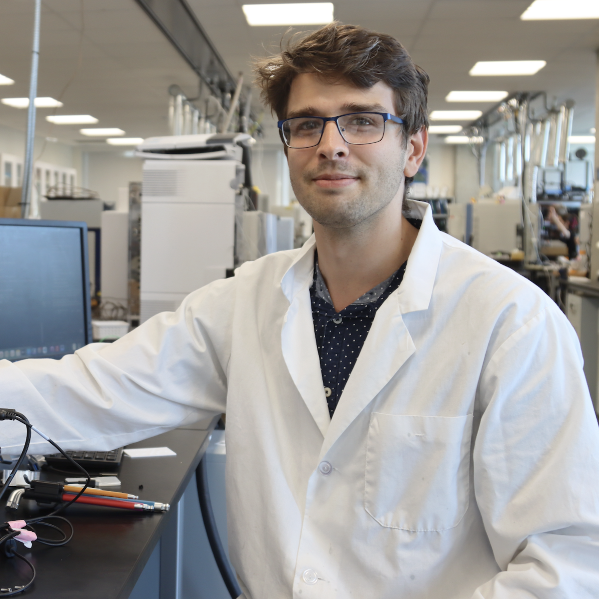 Joseph Monaghan in the lab showing the equipment