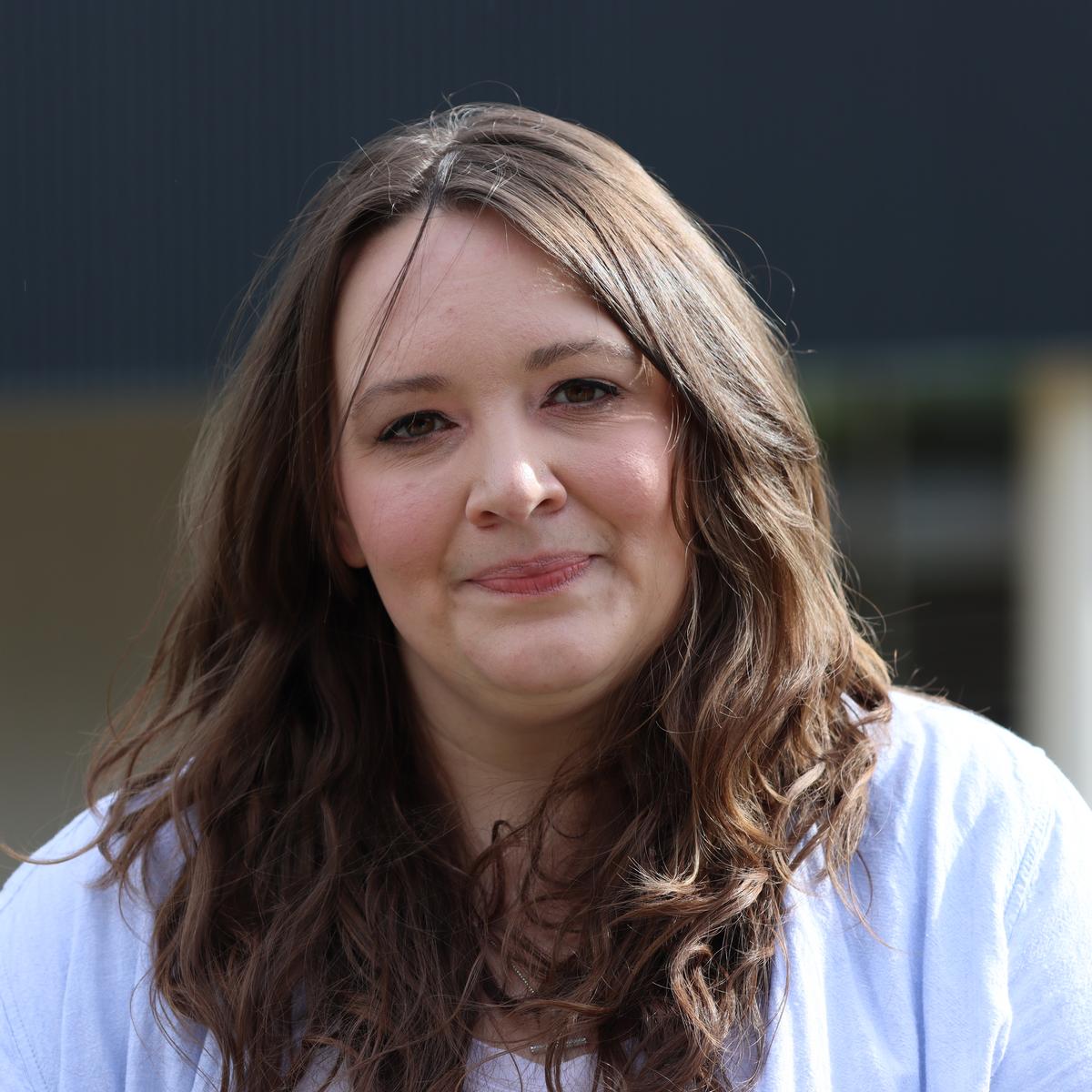 Laci standing outside and smiling at the camera