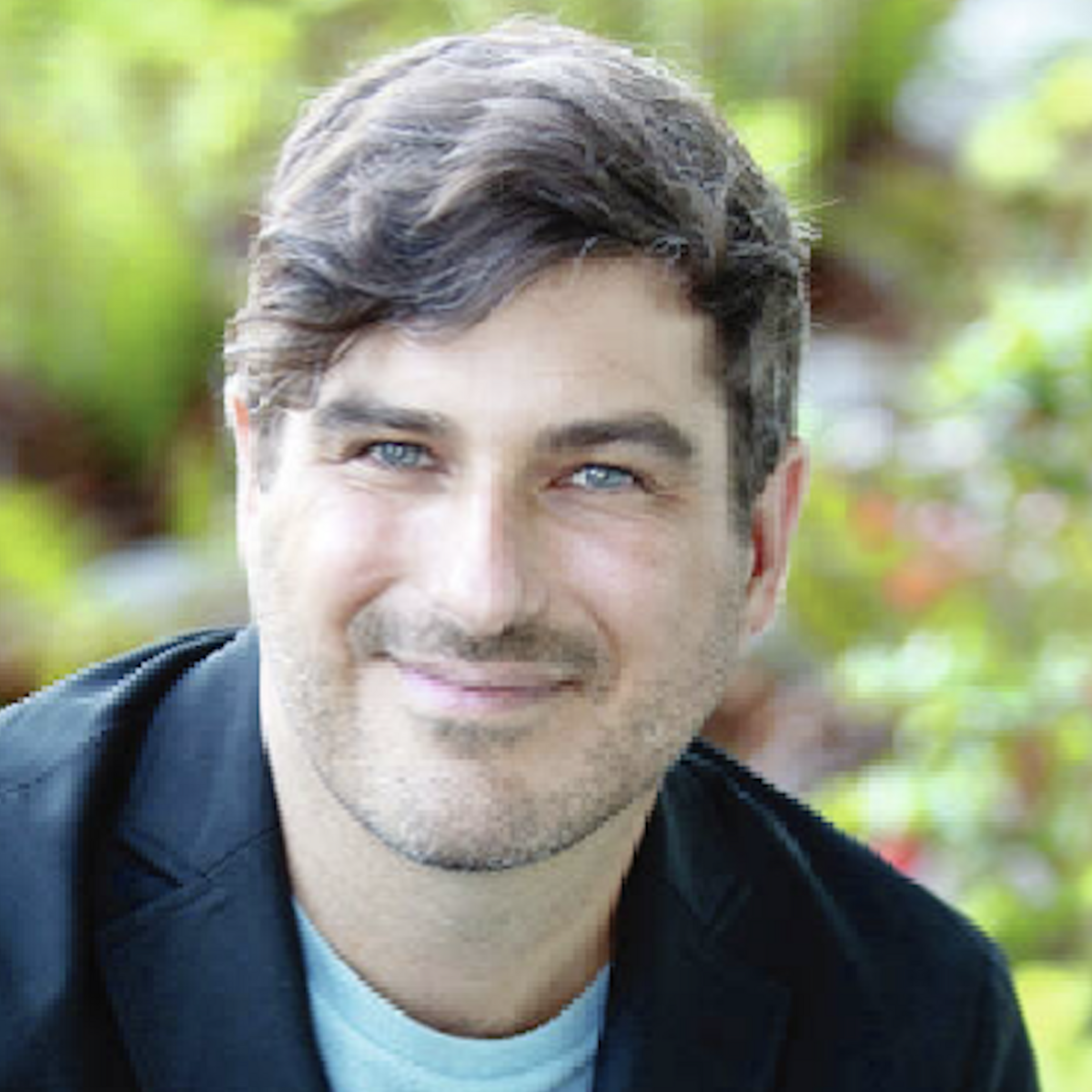 Michael MacKenzie smiling at the camera.