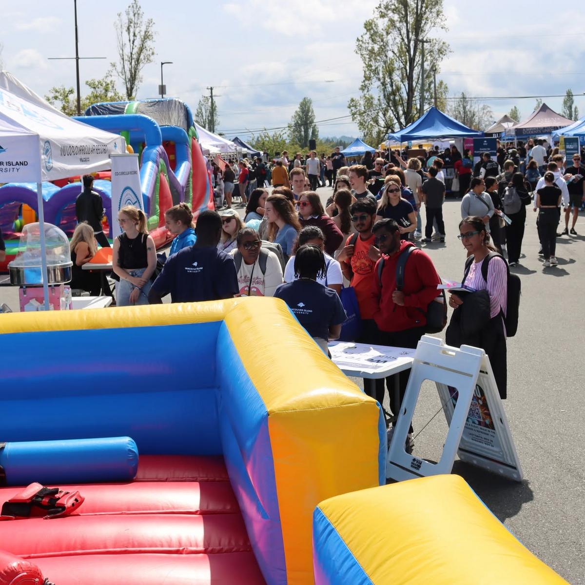 srudents outside enjoying the rock viu connect fair