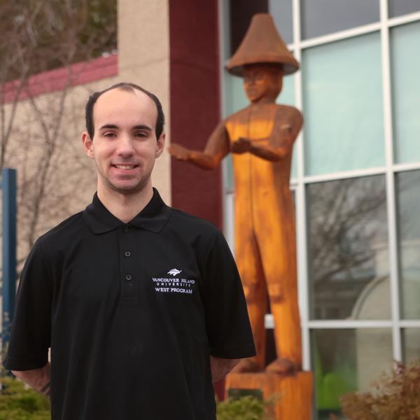 Esteban in front of the campus