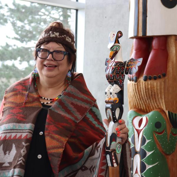Chancellor, Cloy-e-iss, Dr. Judith Sayers with the Talking Stick and totem