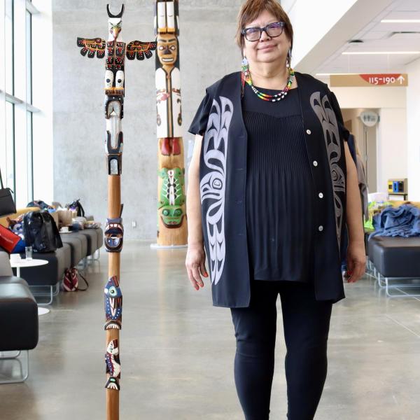 Chancellor, Cloy-e-iss, Dr. Judith Sayers with the Talking Stick and totem