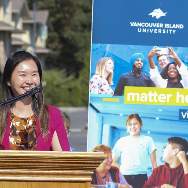 Anne Kang, Minister of Advanced Education and Skills Training, announces funding for a new student residence building. 