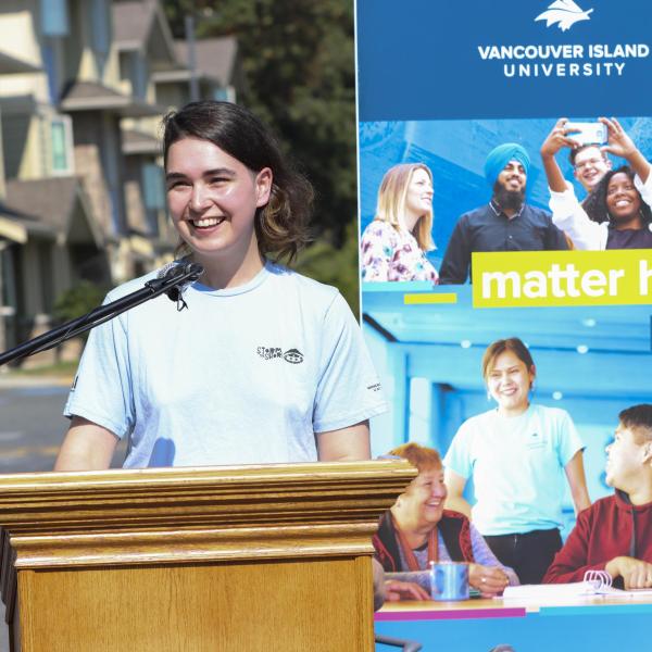 Cole Reinbold, a VIU student and Community Leader in VIU Residences, speaks at the announcement