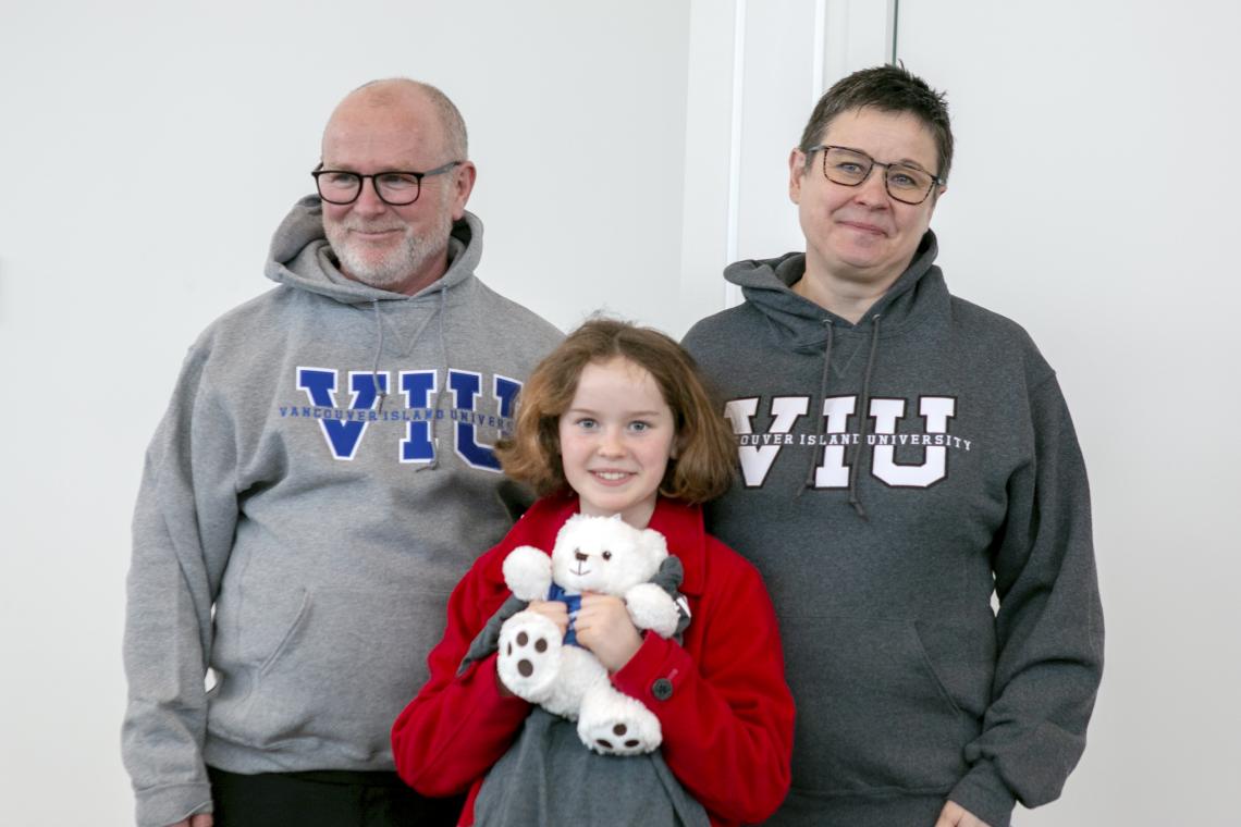 Dr. Deborah Saucier with her family in VIU hoodies