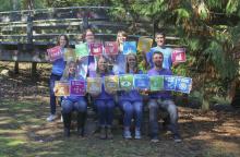 Members of MABRRI hold sustainable Development Goal icons.