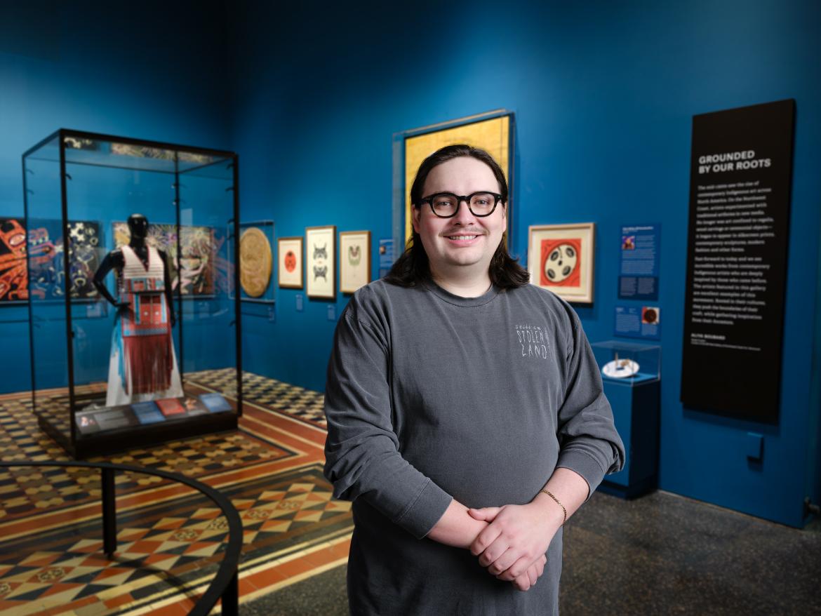 Eliot stands in front of his exhibit at the Museum of Natural History