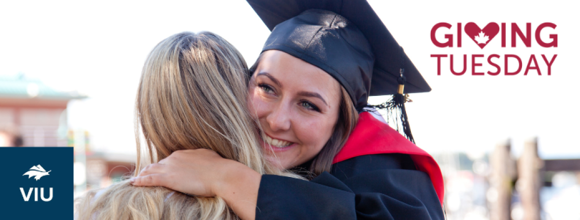 Student in grad cap hugs someone with words Giving Tuesday on side