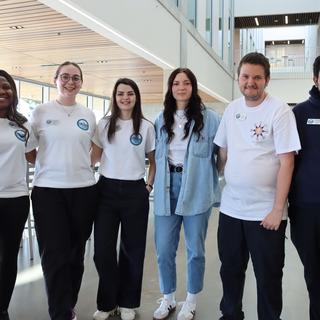 Six Vancouver Island University students standing inside a building