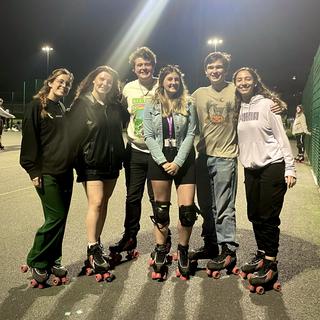 a group of students wearing roller skates