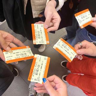 hands hold train tickets