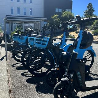 A row of electric bikes parked at VIU's Nanaimo campus