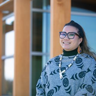 Leah stands in front of gathering place