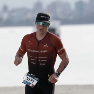Ryan Seamn running outside during a triathlon.