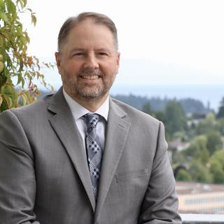Dennis Johnson with a view of the city of Nanaimo behind him