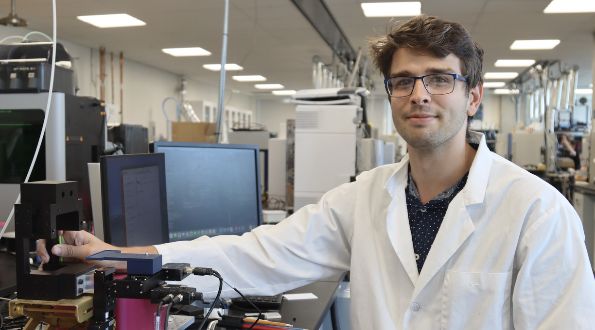 Joseph Monaghan in the lab showing the equipment
