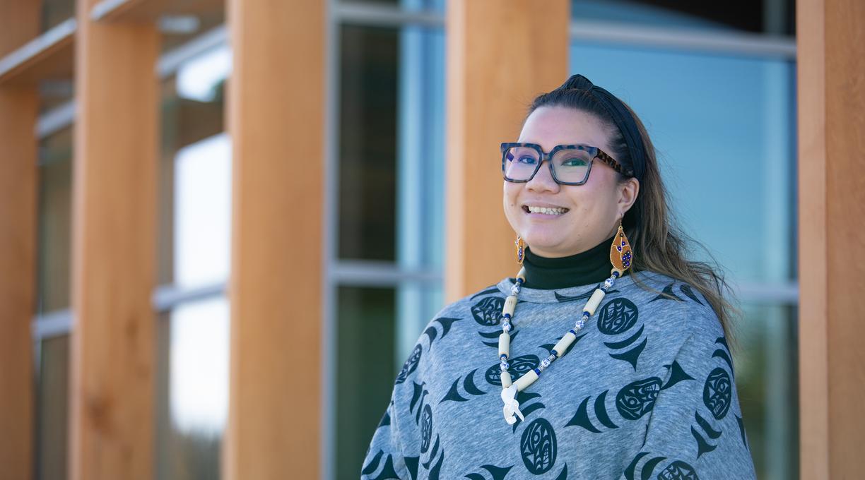 Leah stands in front of gathering place