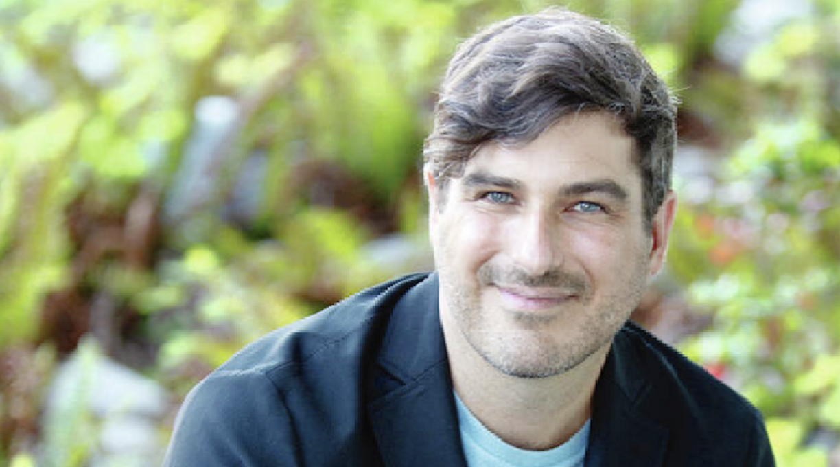 Michael MacKenzie smiling at the camera.