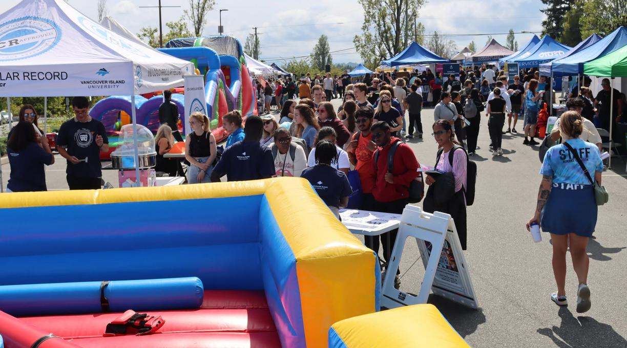 srudents outside enjoying the rock viu connect fair