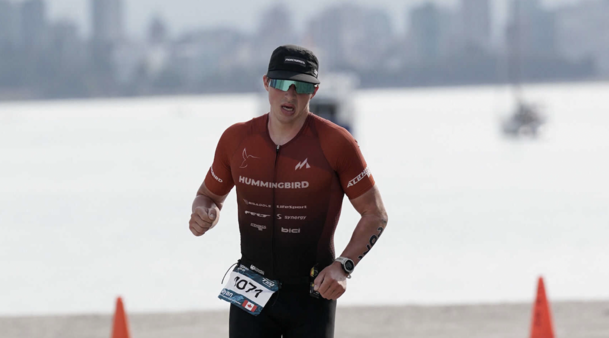 Ryan Seamn running outside during a triathlon.