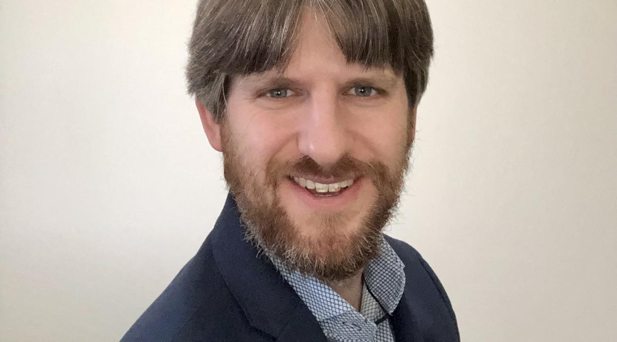 Daniel Westlake from the shoulders up with a white background