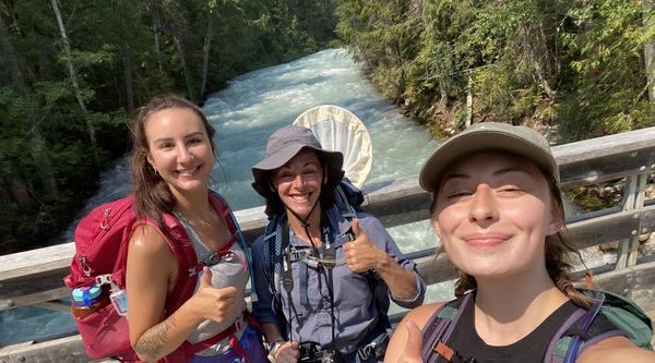 Lizzy Schafers, Jasmine Janes and Emma Peterson  give the thumbs up sign while taking a selfie.
