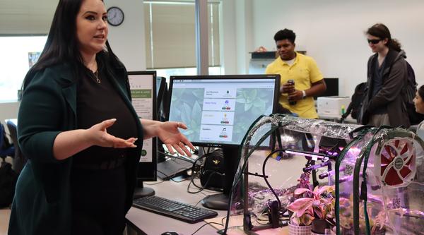 a student at the ITAS fair showing and talking abut their project