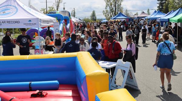 srudents outside enjoying the rock viu connect fair
