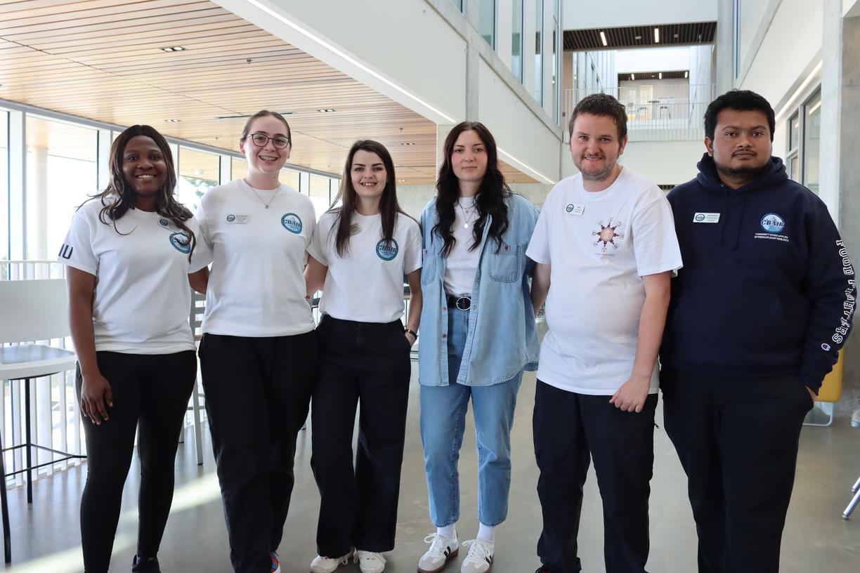 Six Vancouver Island University students standing inside a building