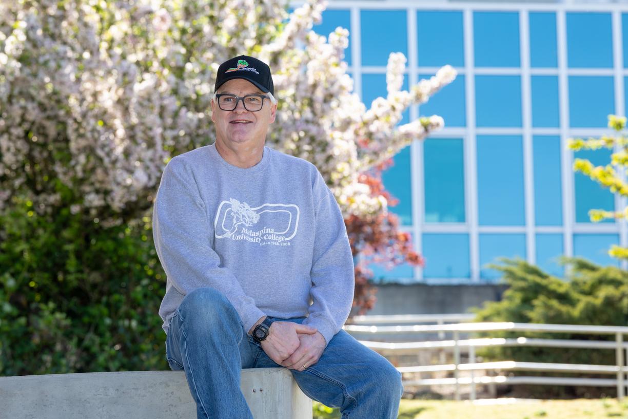 David Butler sitting outside on a sunny day.