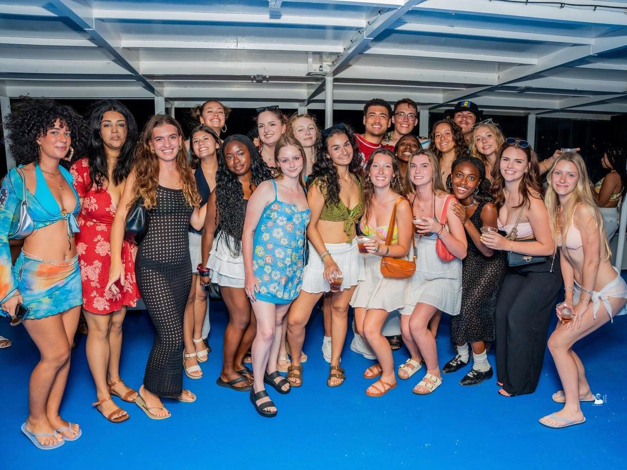 group photo of students in bathing suits and sundresses