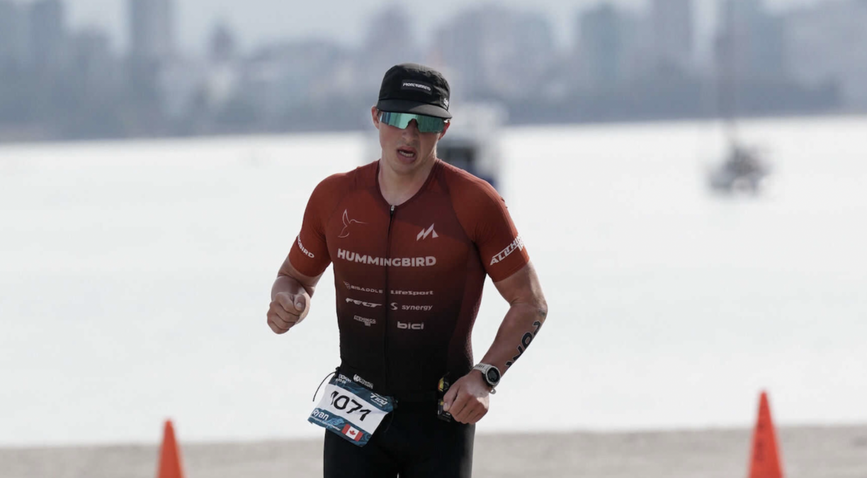 Ryan Seamn running outside during a triathlon.