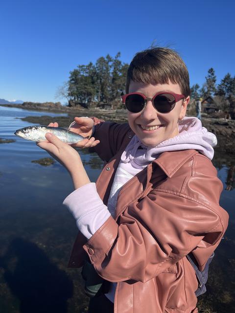 Allie Unger holds up a fish.