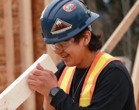 A VIU carpentry student working on a housing construction site