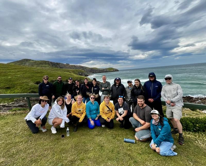 group photo with beach behind