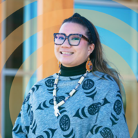 Smiling woman in indigenous apparel 