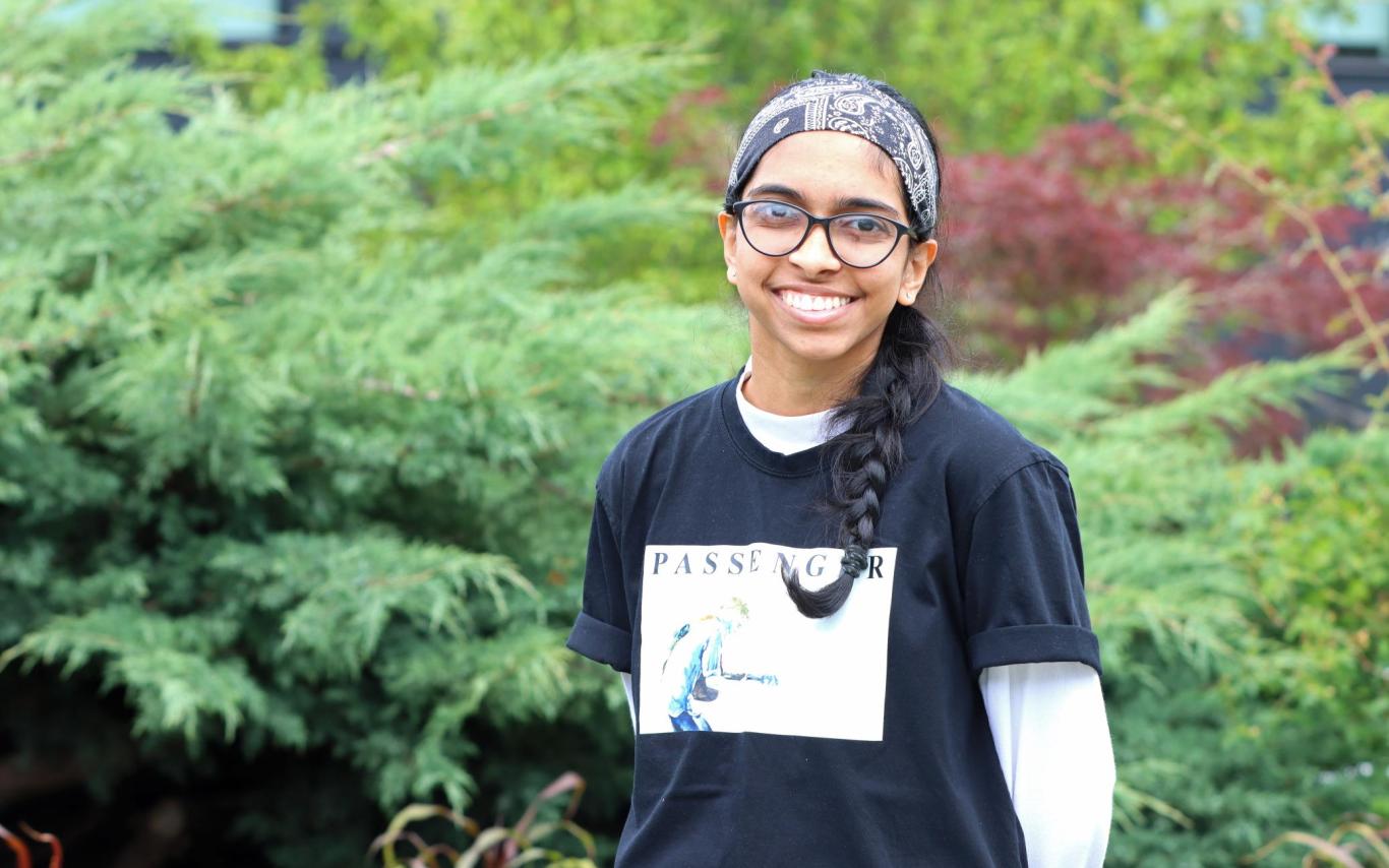 Becky stands in front of greenery at VIU's Nanaimo campus