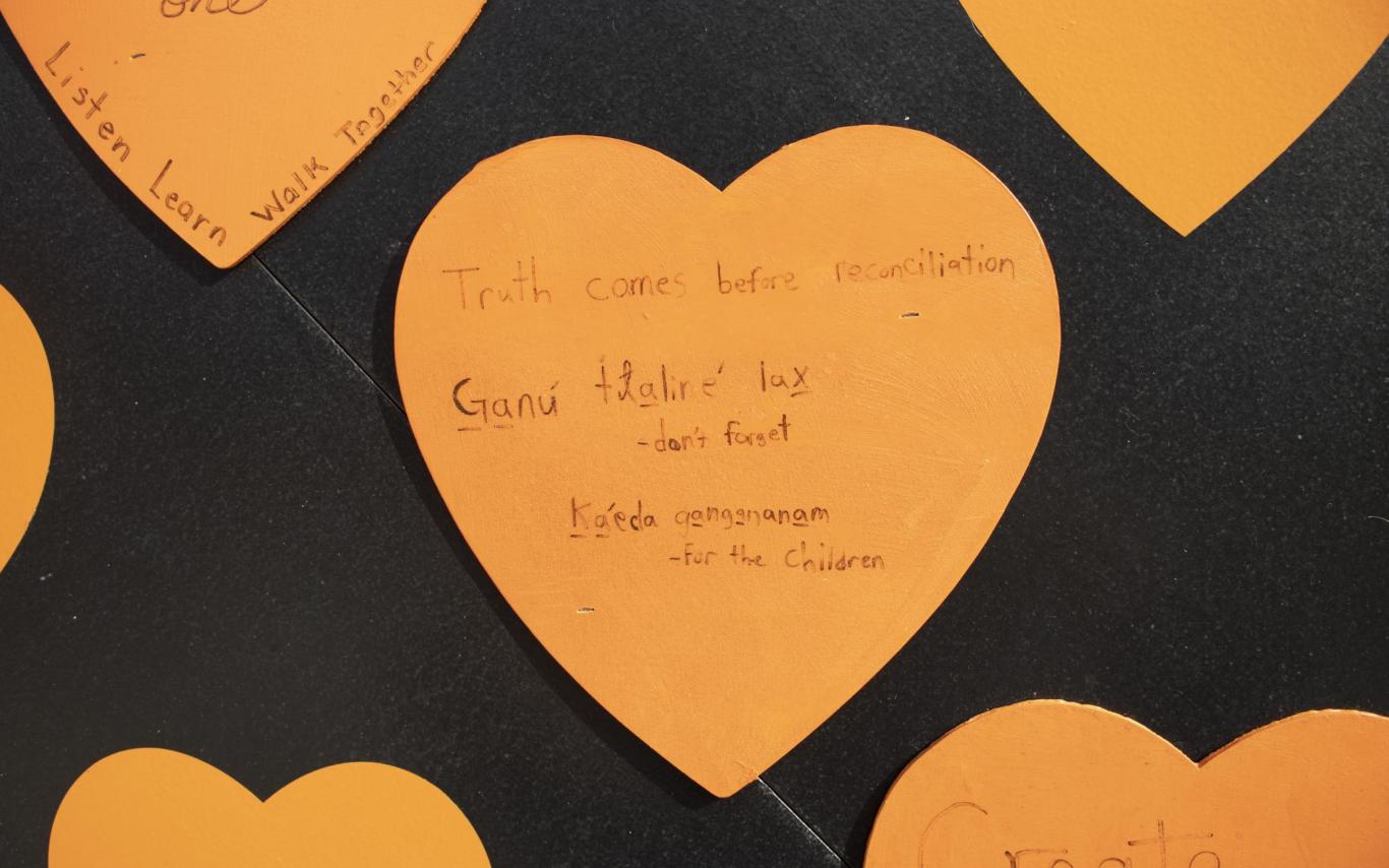 Orange heart reads "truth comes before reconciliation" and "Ganu tlalire lax" (don't forget) and kaeda gangananam (for the children)