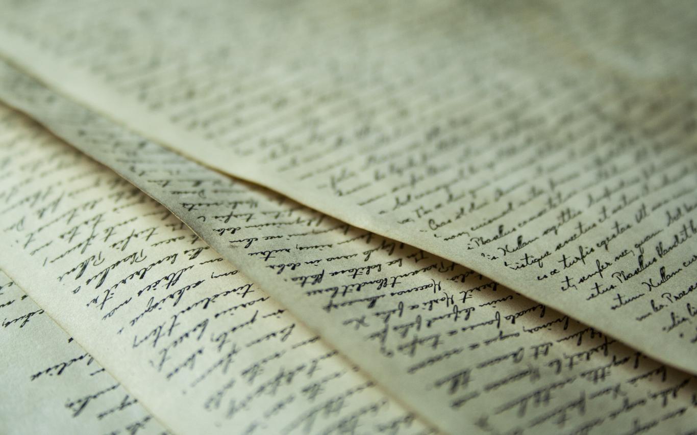 Sheets of paper with writing on them