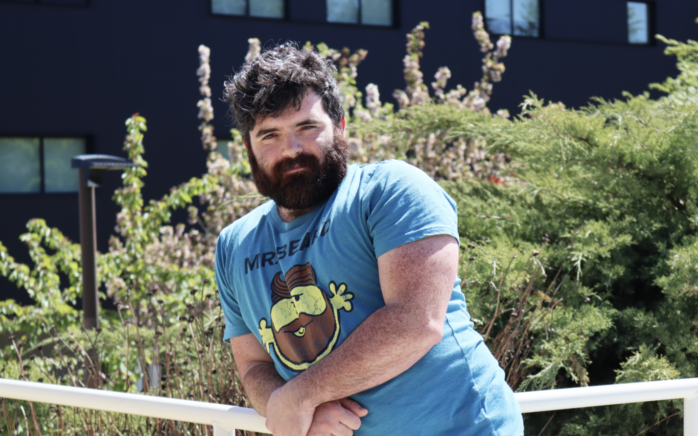 Philip Lawton leaning on railing and looking at the camera