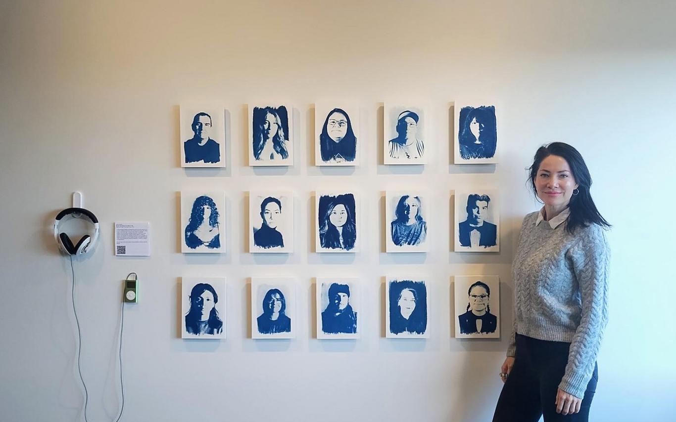 Tarah Dowling stands next to her exhibit.