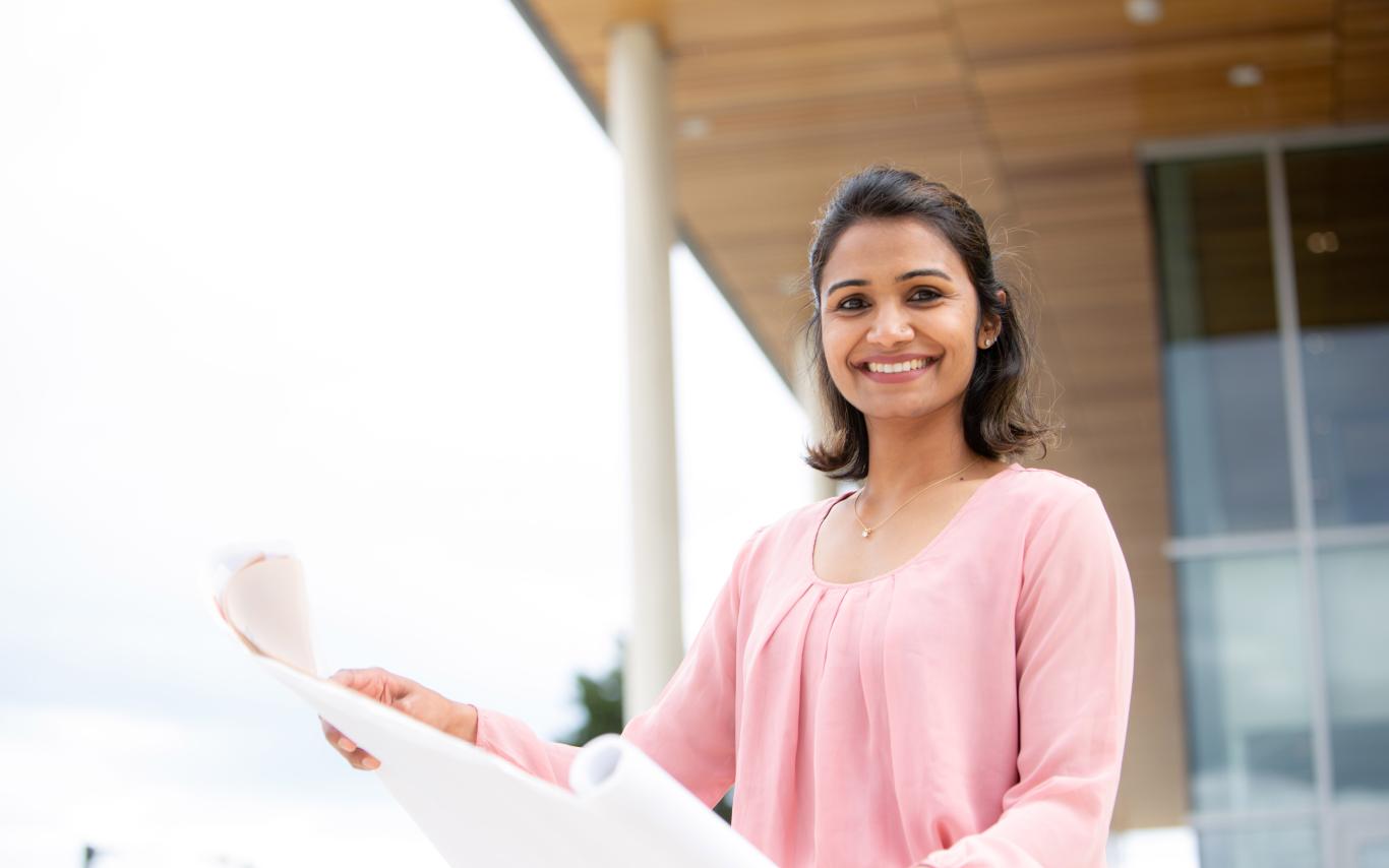 Student holding a paper
