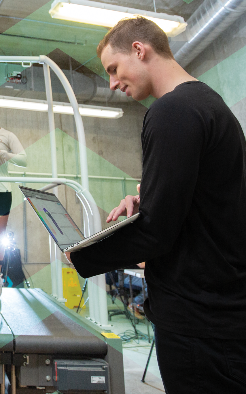 Young man working in a kinesiology lab. 