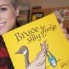 VIU alum Amy Pye holding her new children's book